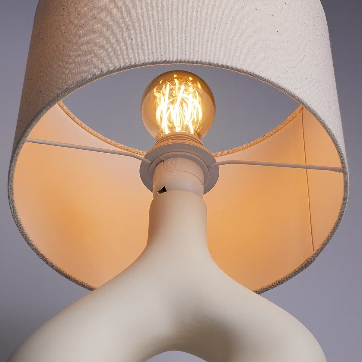 Table lamp with a ceramic base and fabric shade - Industrial design