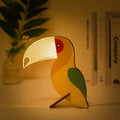 Wooden table lamp with an animal motif - warm LED light