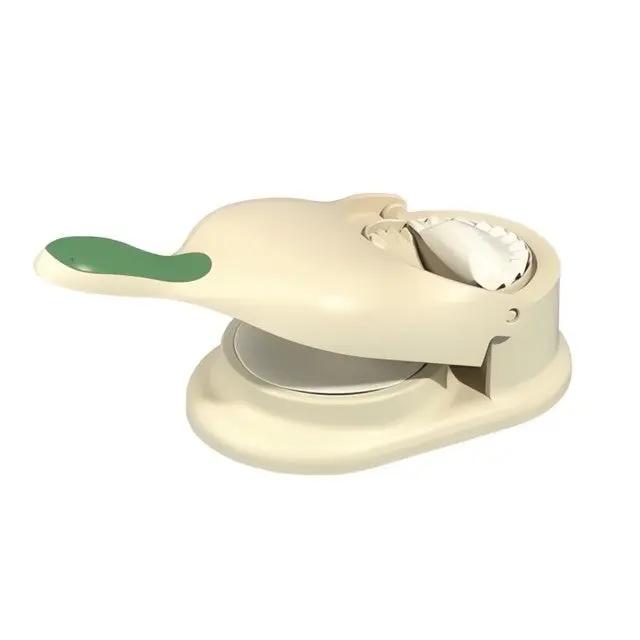 Single beige 2-in-1 Knödel Teigtaschenformer with formed dumpling on white background