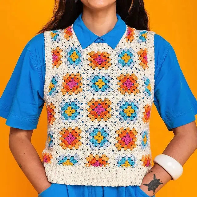 Woman wearing crochet vest made with 50 Häkelkarten mit bunten Mustern patterns