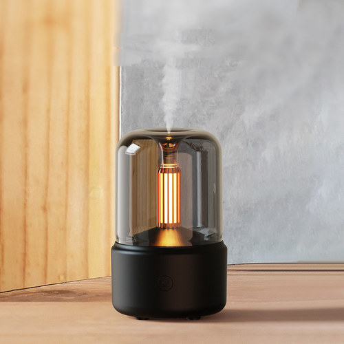 Black Aroma-Diffusor Nachtlicht with glass dome emitting vapor on wooden surface