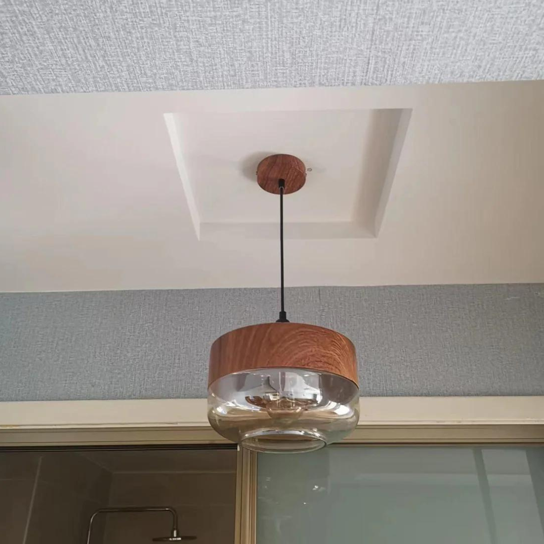 Scandinavian pendant light made of glass and metal with a wood look
