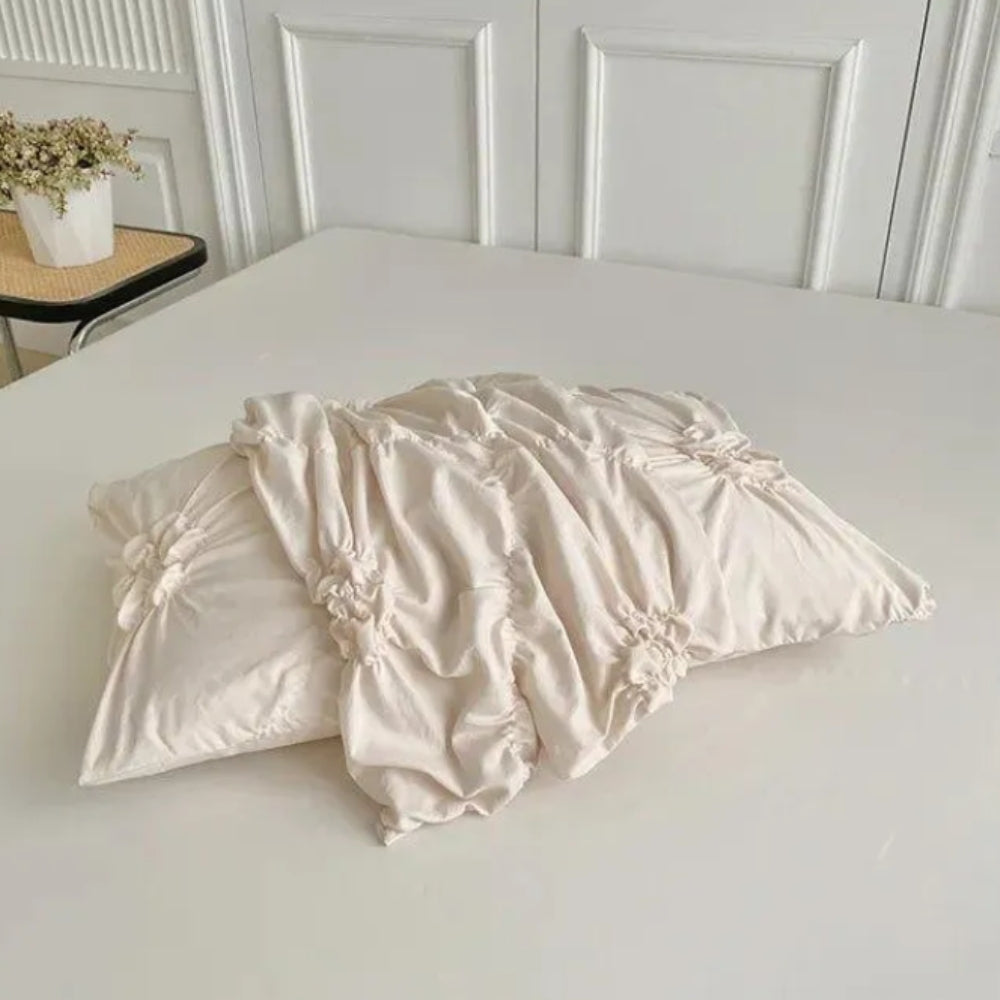 Bedding set with ruffles and floral pattern, including pillowcases