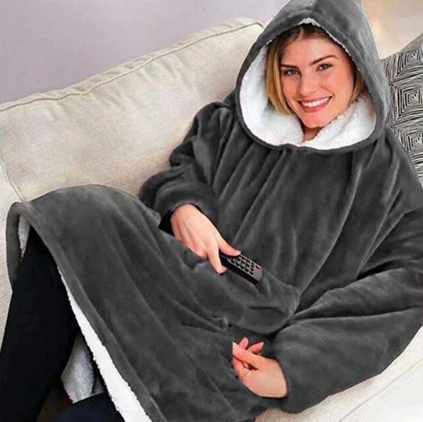 Blanket hoodie with fleece lining, hood, and front pocket