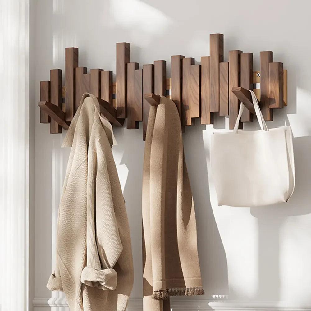 Wall-mounted coat rack with magnetic folding hooks made of wood - modern design