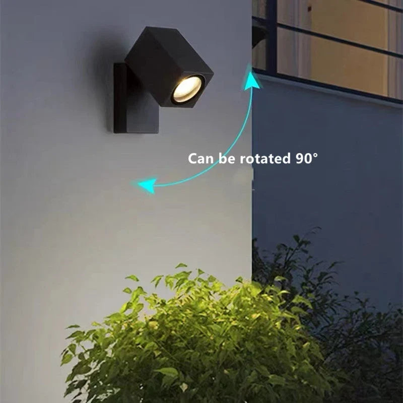 Outdoor wall light with integrated LED and adjustable swing arm
