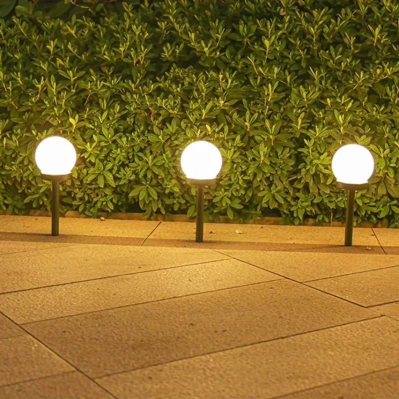 Round LED solar garden light with automatic light control