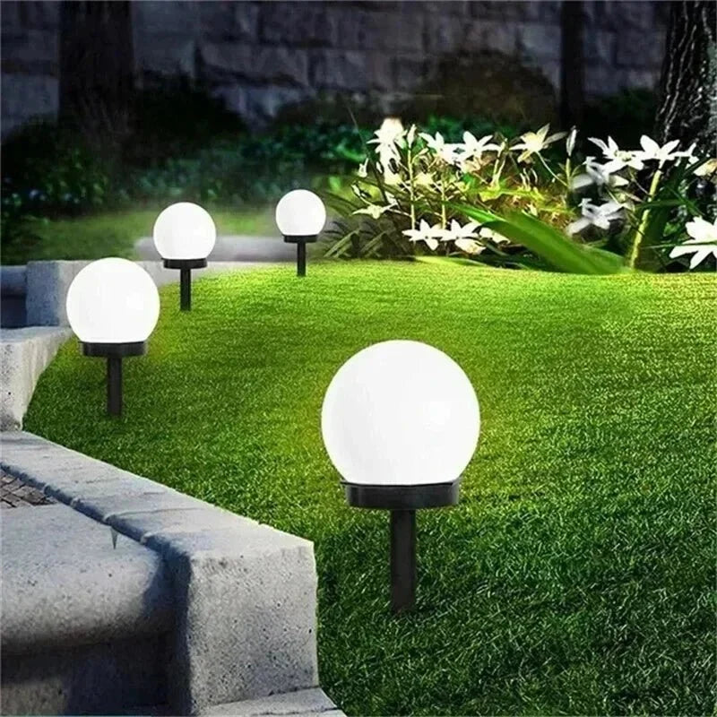 Round LED solar garden light with automatic light control