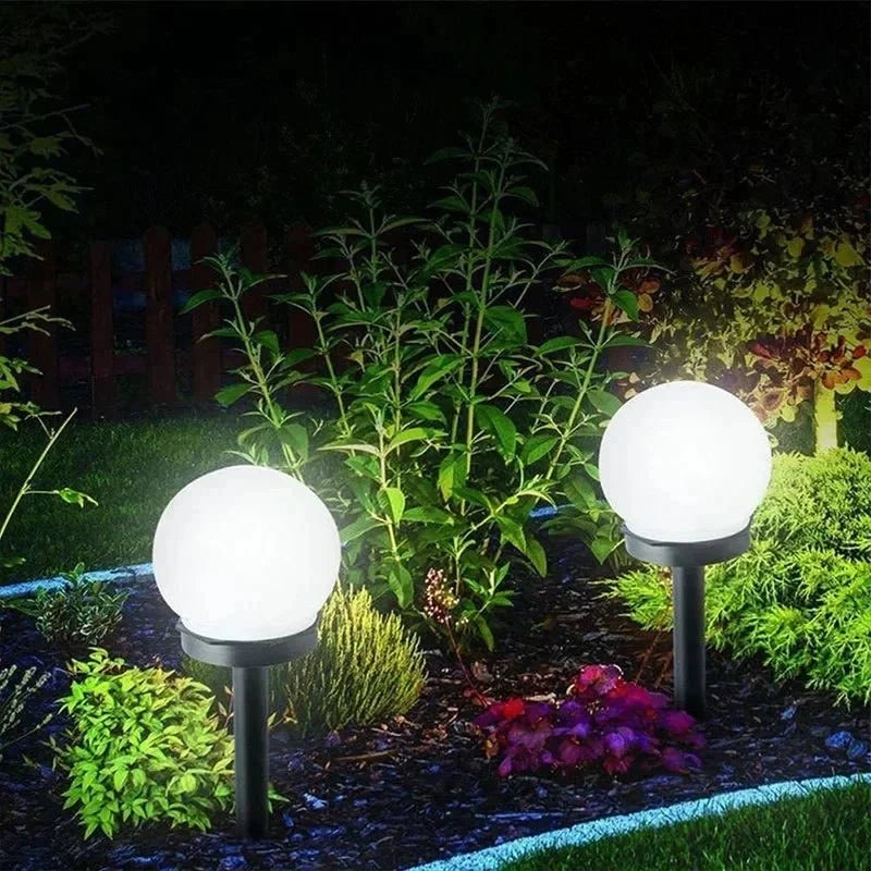 Round LED solar garden light with automatic light control