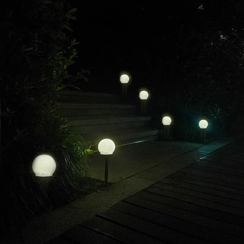 Round LED solar garden light with automatic light control