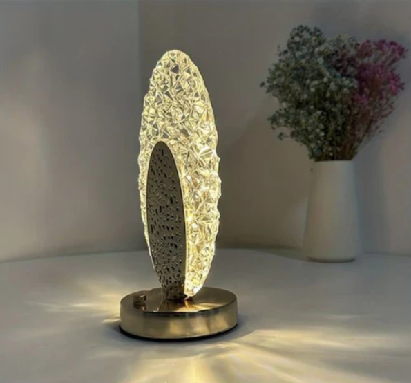 Table lamp with peacock design and crystal-like light reflections