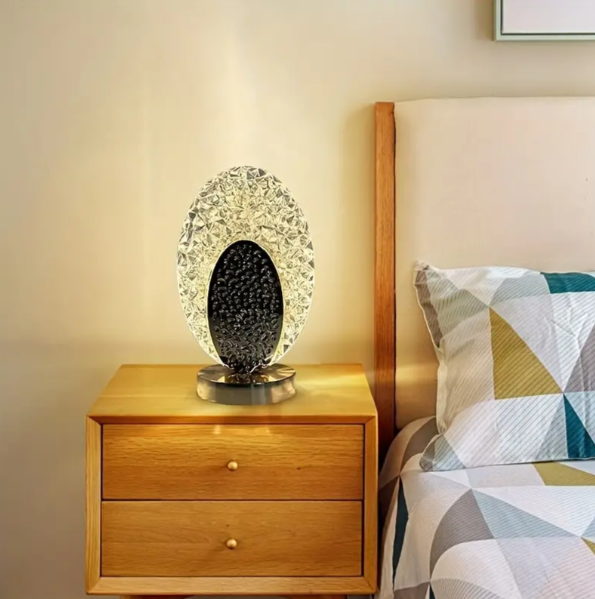 Table lamp with peacock design and crystal-like light reflections