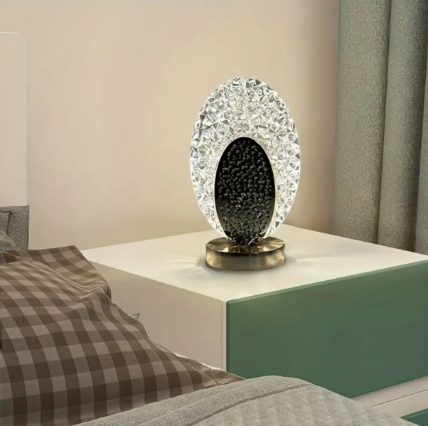 Table lamp with peacock design and crystal-like light reflections