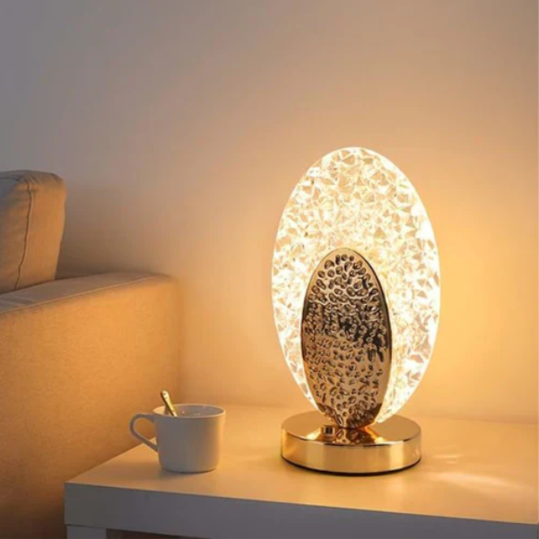 Table lamp with peacock design and crystal-like light reflections