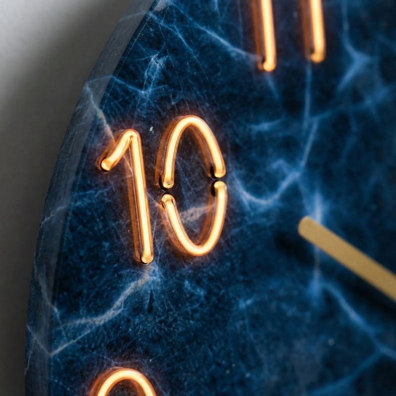 Modern wall clock with illuminated numerals and silent movement