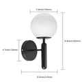 Glass wall light with a spherical shape for an elegant ambiance