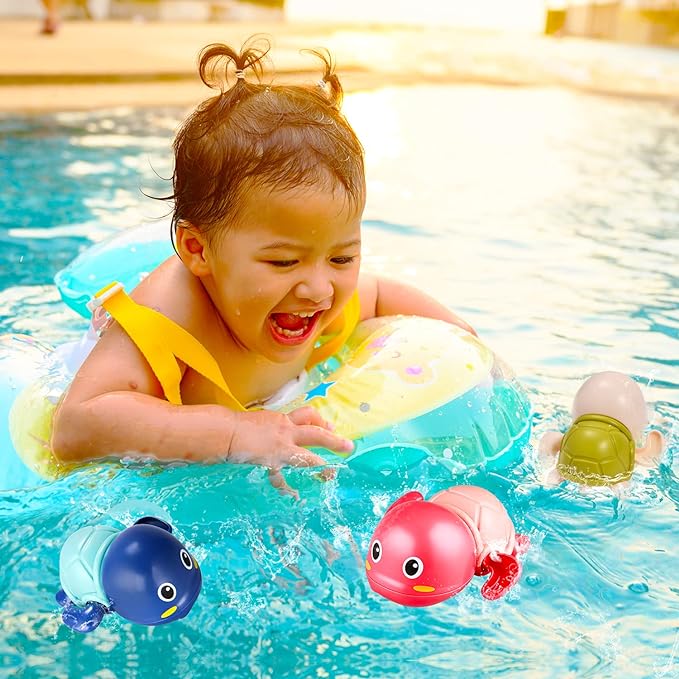Child with swim floaties playing with colorful Aufzieh-Schwimmschildkröten Badespielzeug in pool