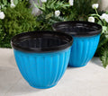 Planter with spiral rib design for healthy root growth
