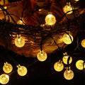 Solar LED string lights with crystal balls for garden and patio