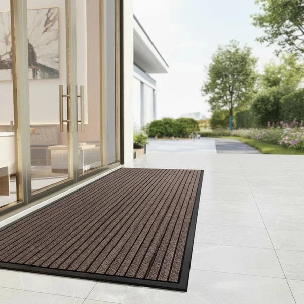 Dirt-trapping mat with non-slip backing for the entryway