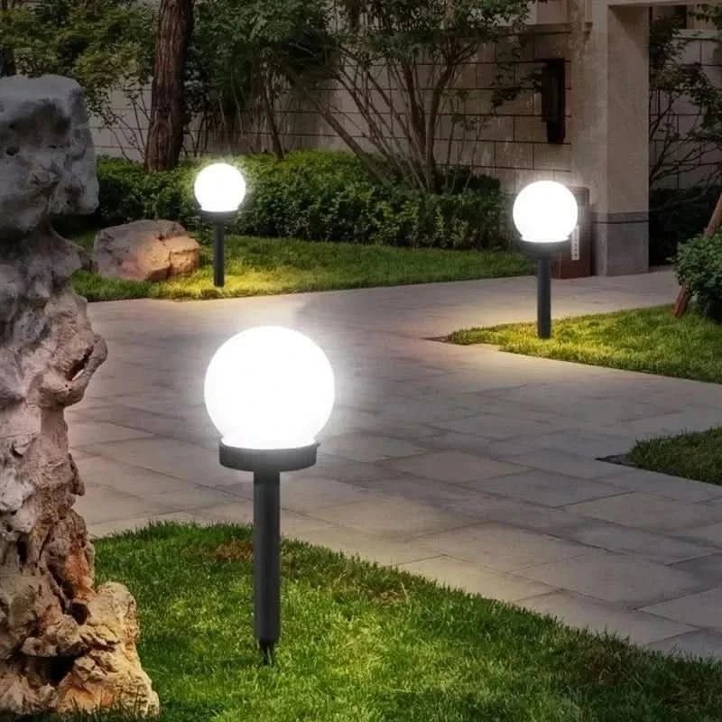Round LED solar garden light with automatic light control